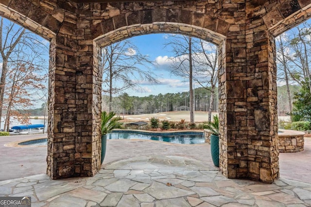 view of pool featuring a patio