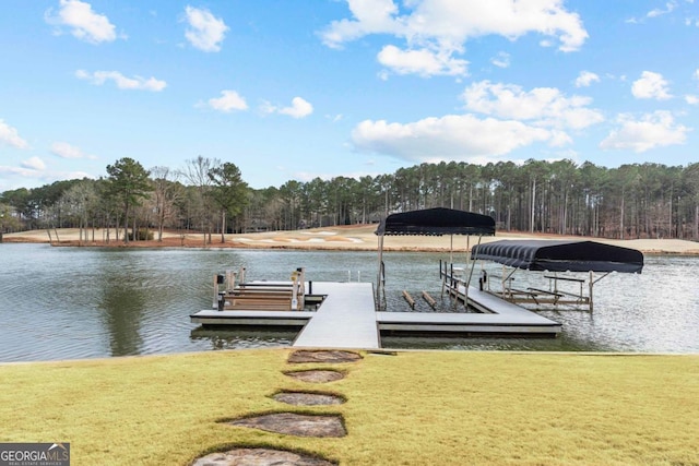 dock area featuring a water view and a yard