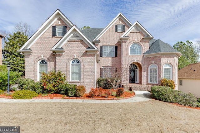 view of front of home featuring brick siding