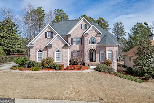 view of front of house with brick siding