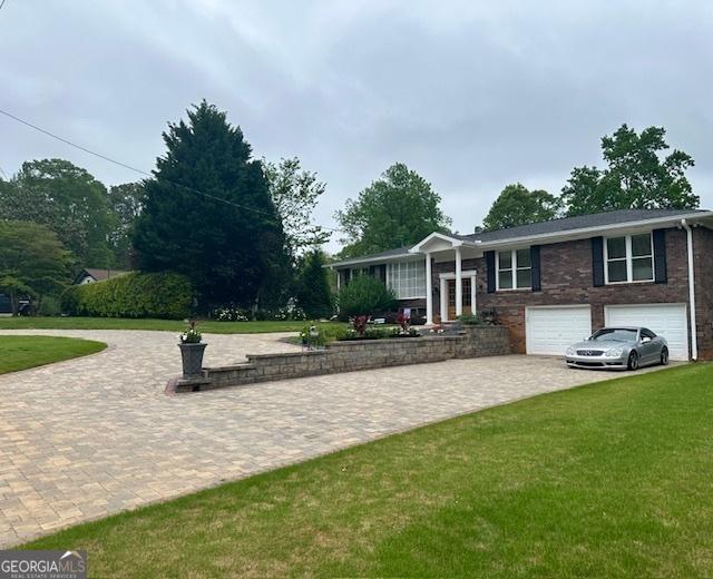 exterior space featuring driveway and a garage