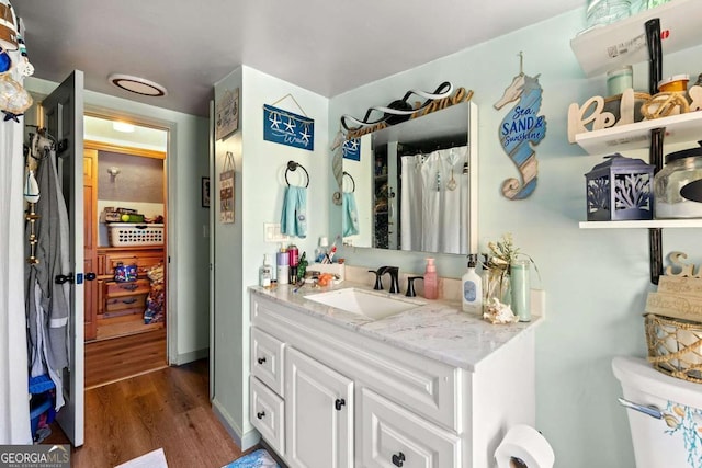 bathroom with vanity and hardwood / wood-style flooring