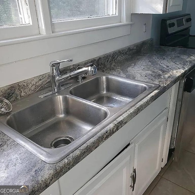 749 Grenada Ter, Macon, GA 31206 - kitchen view of white cabinetry and stove