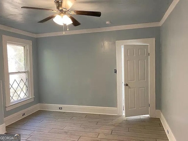 749 Grenada Ter, Macon, GA 31206 - spare room featuring wood finished floors, plenty of natural light, ornamental molding, and ceiling fan