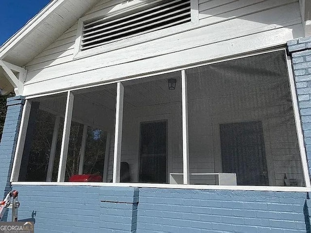 749 Grenada Ter, Macon, GA 31206 - view of side of home featuring a sunroom