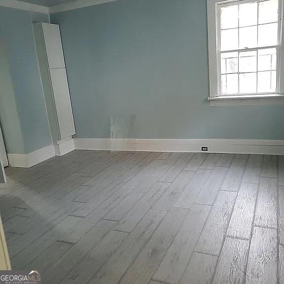749 Grenada Ter, Macon, GA 31206 - empty room featuring wood finished floors and crown molding