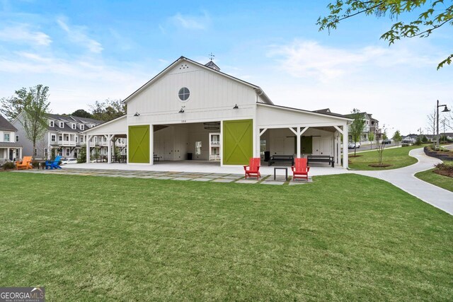 578 Brashy St, Woodstock, GA 30188 - rear view of property featuring a yard