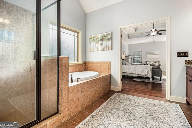 bathroom with a healthy amount of sunlight, vanity, shower with separate bathtub, and tile patterned floors