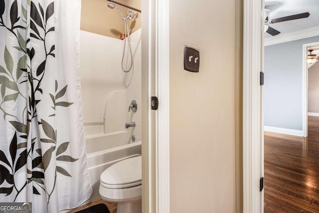 bathroom with hardwood / wood-style flooring, ceiling fan, shower / bath combo, ornamental molding, and toilet