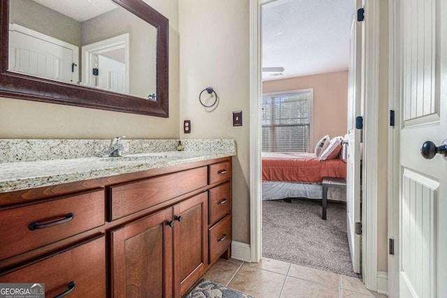 bathroom with tile patterned floors and vanity