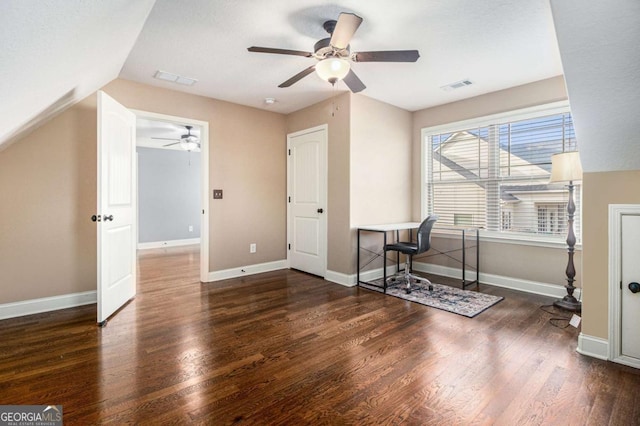 unfurnished office with lofted ceiling and dark hardwood / wood-style flooring