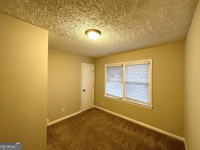2922 Dale Pl, Decatur, GA 30032 - unfurnished room featuring dark carpet and a textured ceiling