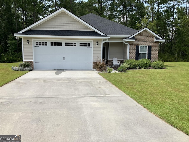 270 Bridgewater Ln SE, Darien, GA 31305 - ranch-style house featuring a front yard, a shingled roof, concrete driveway, an attached garage, and brick siding