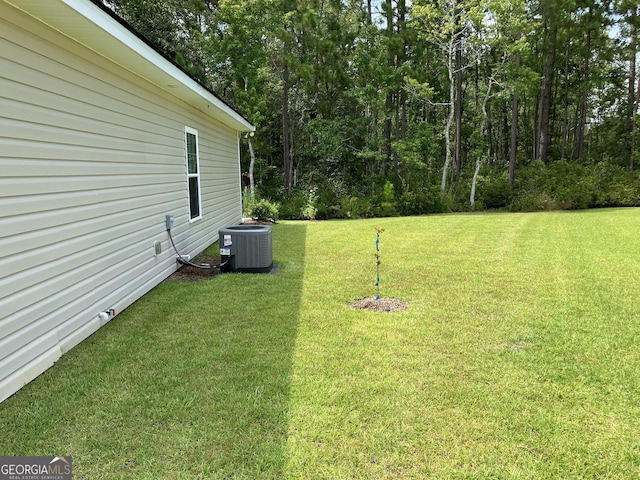 view of yard with central air condition unit