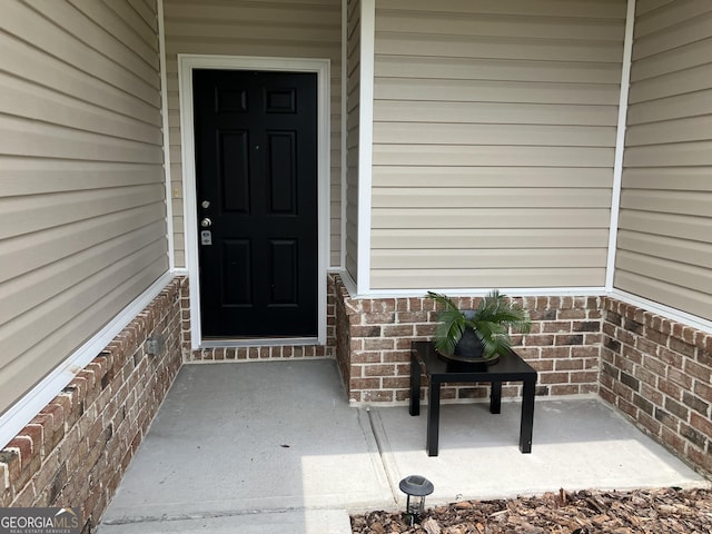 270 Bridgewater Ln SE, Darien, GA 31305 - doorway to property with brick siding