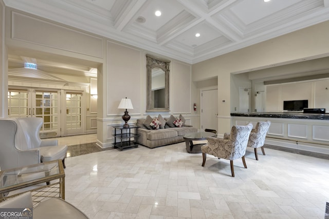 living area with crown molding, beamed ceiling, and a decorative wall