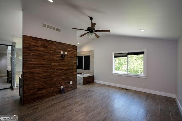 interior space with wood-type flooring, lofted ceiling, and ceiling fan