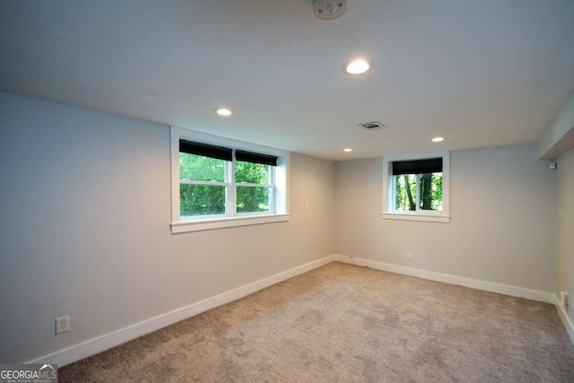 unfurnished room featuring carpet flooring