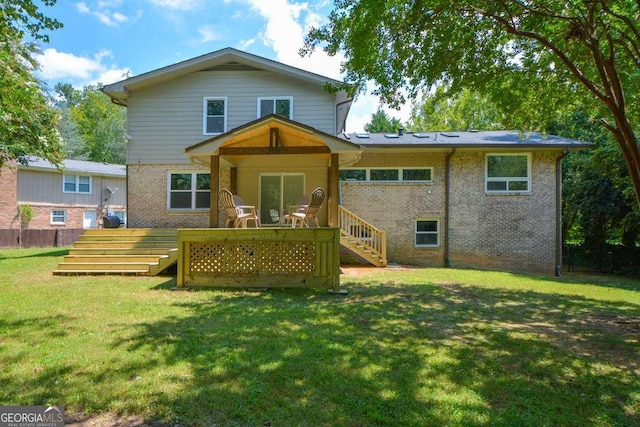 back of house with a lawn