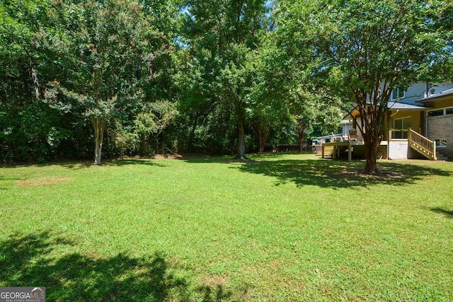 view of yard with a deck