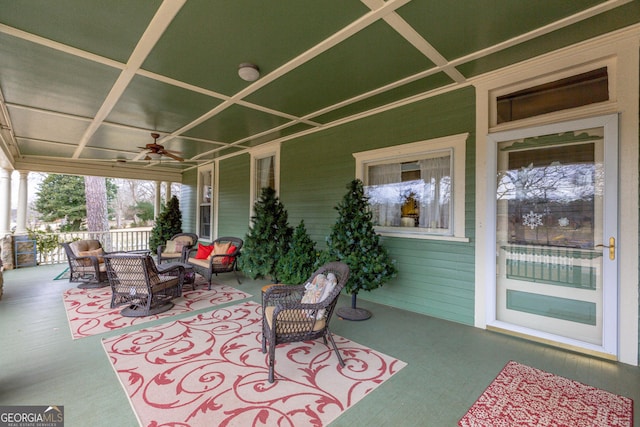 view of patio / terrace featuring ceiling fan, an outdoor living space, and covered porch