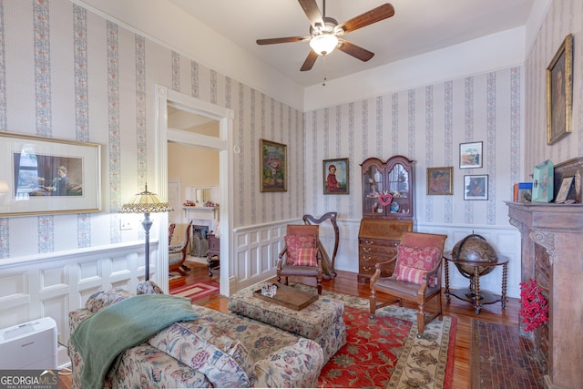 sitting room featuring hardwood / wood-style flooring and ceiling fan