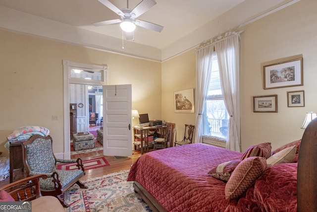 bedroom with hardwood / wood-style flooring and ceiling fan