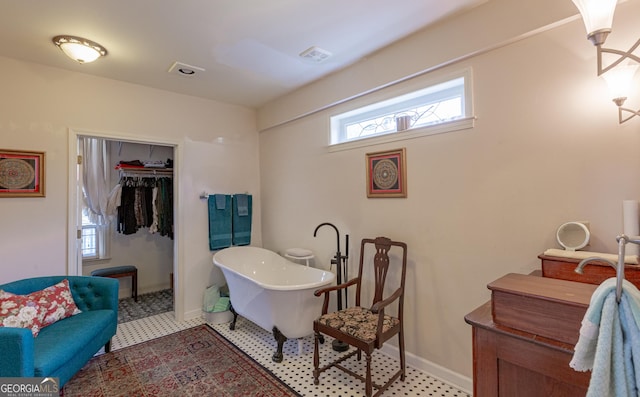 interior space with a bathing tub and vanity