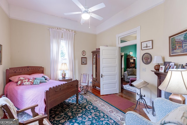 bedroom with wood-type flooring and ceiling fan