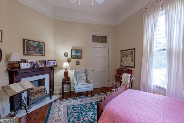 bedroom featuring hardwood / wood-style floors and ceiling fan