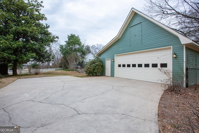 view of side of property with an outbuilding and a garage