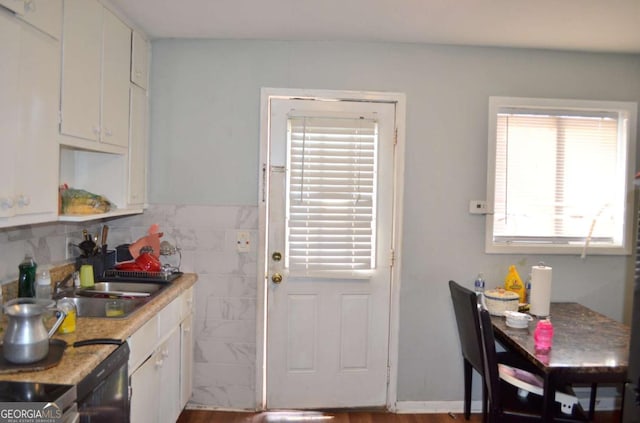 kitchen with white cabinetry and sink