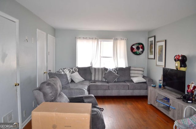 living room featuring dark hardwood / wood-style flooring