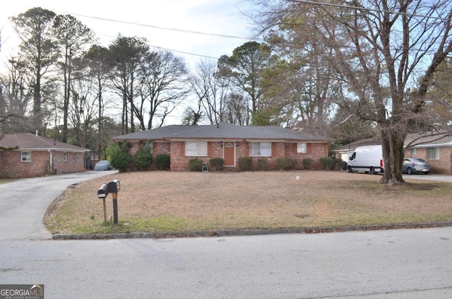 ranch-style house with a front lawn