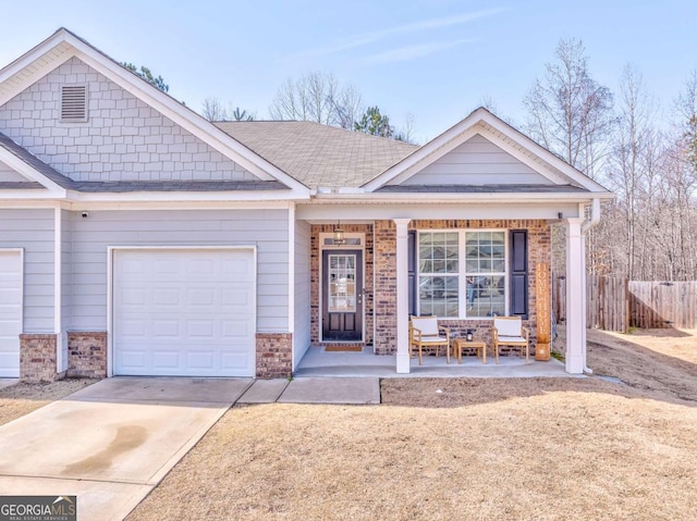 view of front of house with a garage and covered porch