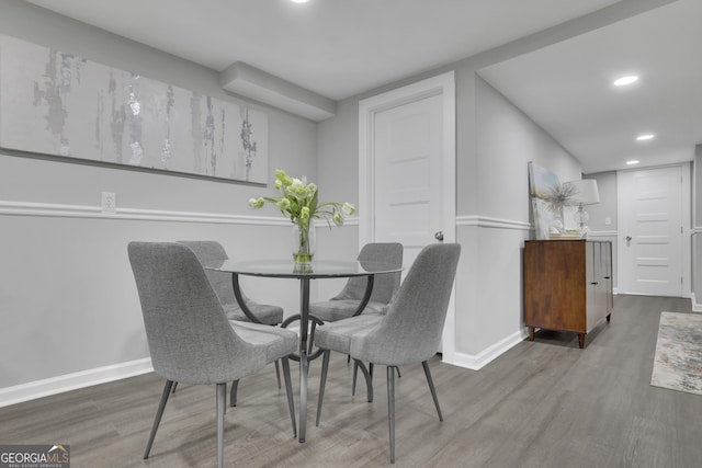 dining room with wood-type flooring