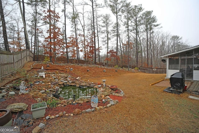 view of yard featuring a sunroom