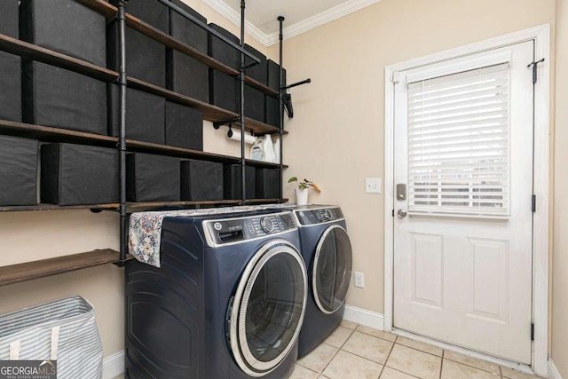 laundry room with light tile patterned floors, ornamental molding, and independent washer and dryer