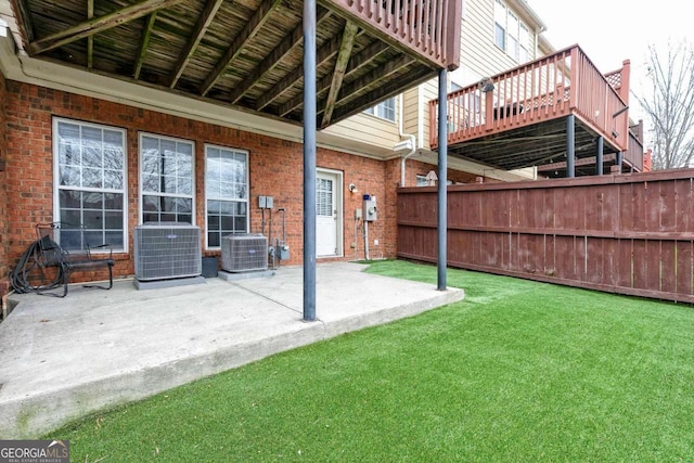 view of patio with a wooden deck and central AC unit