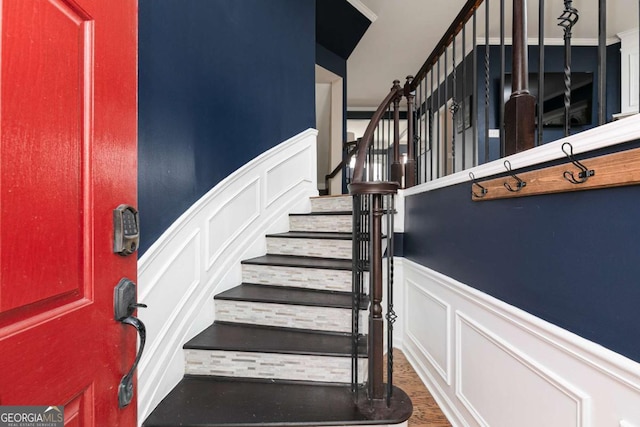 staircase featuring wood-type flooring