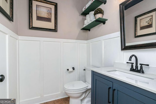 bathroom featuring vanity and toilet