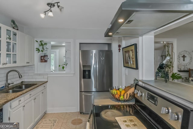 kitchen with range hood, tasteful backsplash, white cabinetry, sink, and stainless steel appliances