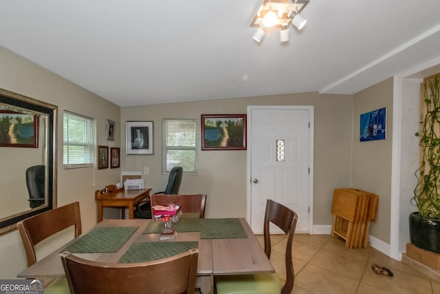 tiled dining room with vaulted ceiling