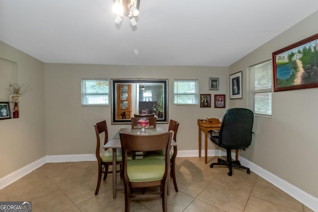 dining area featuring light tile patterned floors and plenty of natural light