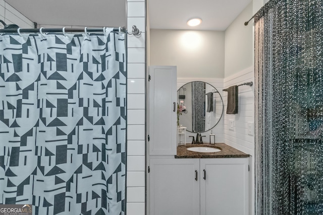 bathroom with vanity and walk in shower