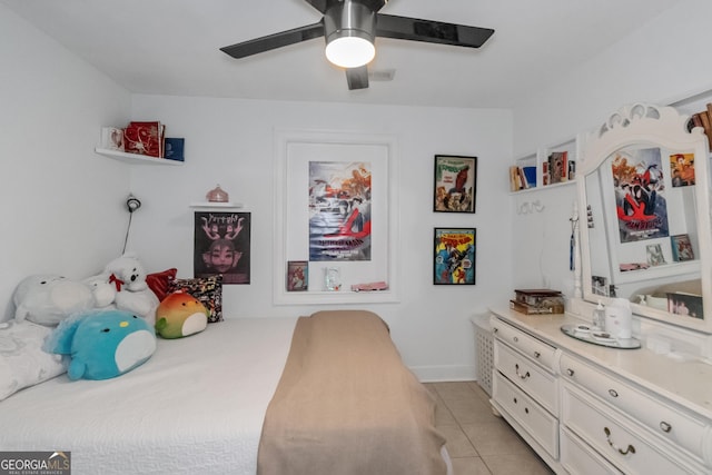 tiled bedroom featuring ceiling fan