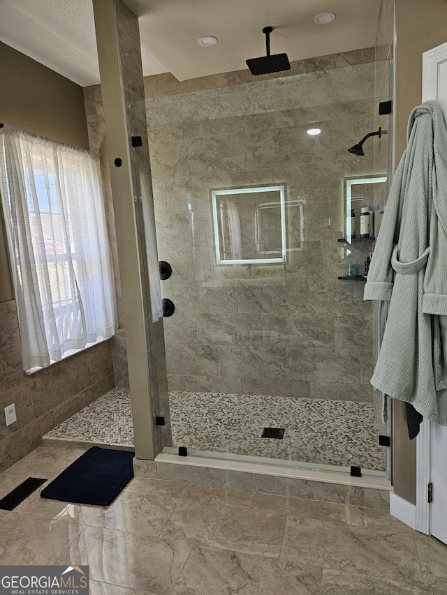 bathroom with a shower with shower door