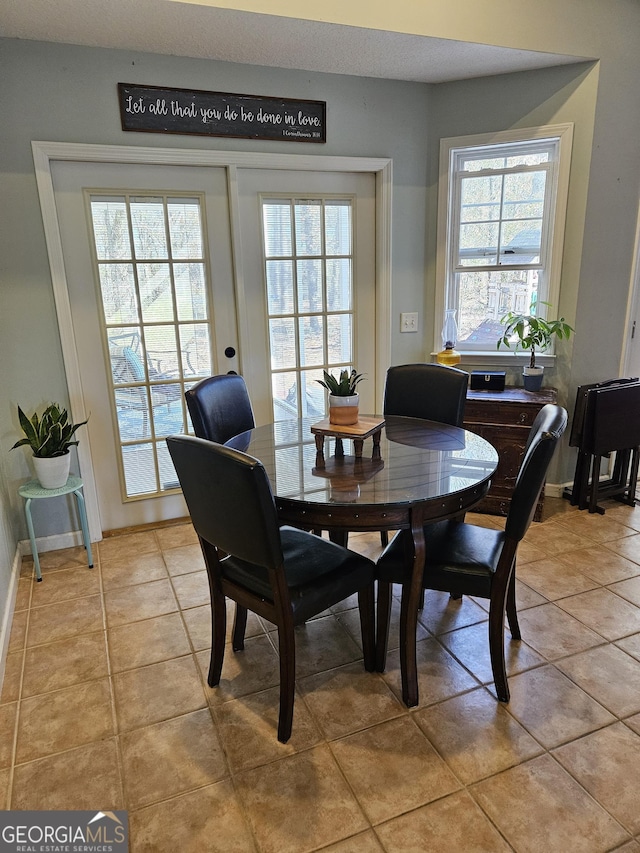 dining space with light tile patterned flooring