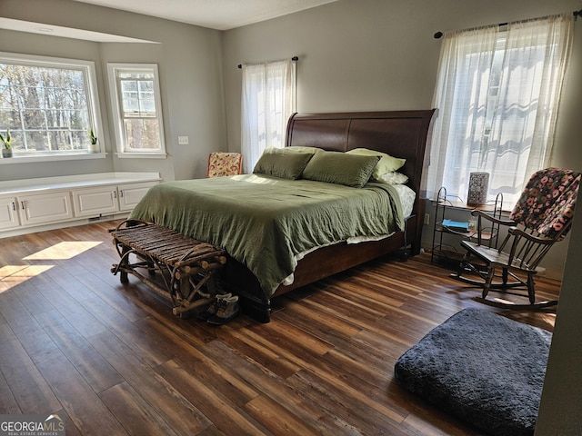 bedroom featuring dark hardwood / wood-style flooring