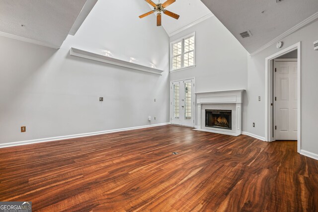 unfurnished living room featuring stairs, french doors, wood finished floors, visible vents, and crown molding
